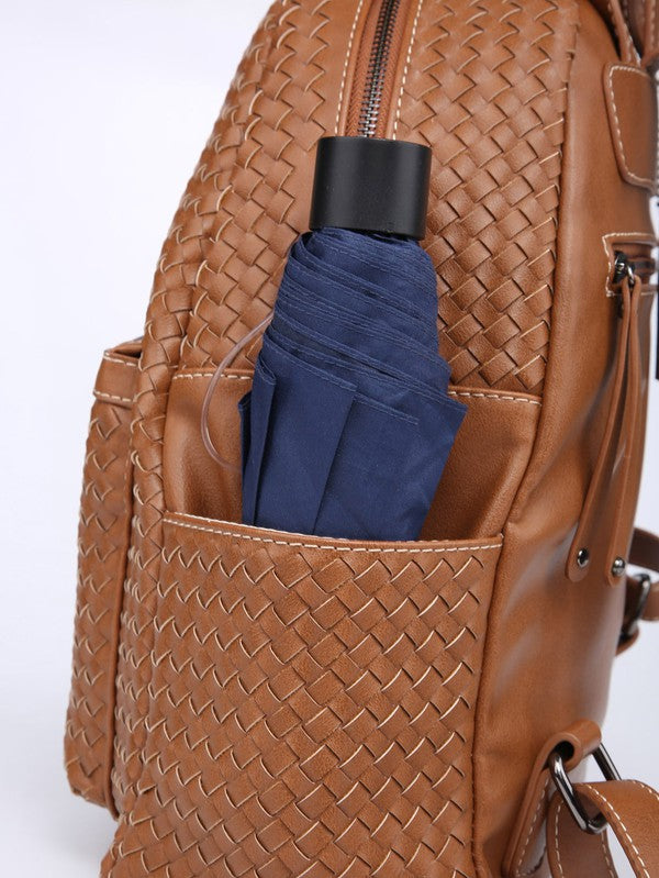 Monedero tipo mochila tejido en marrón